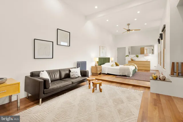 a living room with furniture and a table