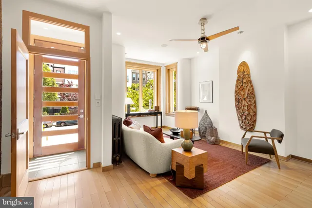 a living room with furniture and a window
