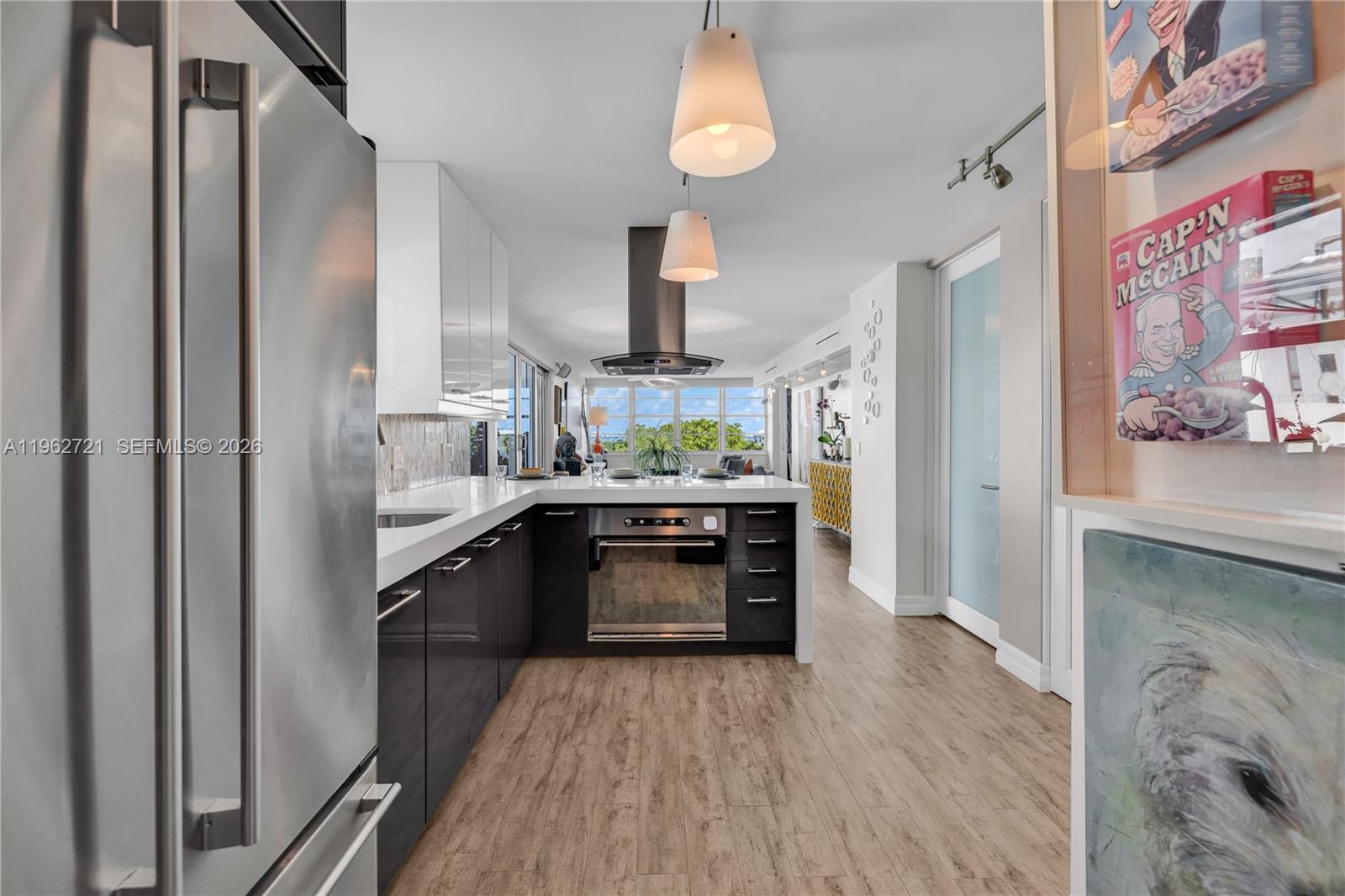 680 Northeast 64th Street, Unit APH3 Miami, FL 33138 - Photo 16 of 77 a kitchen with stainless steel appliances a stove and a refrigerator