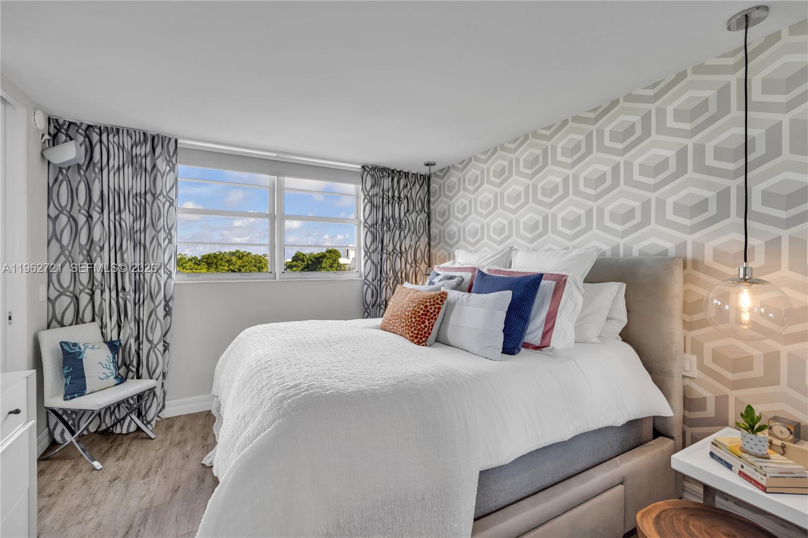 680 Northeast 64th Street, Unit APH3 Miami, FL 33138 - Photo 29 of 77 a bedroom with a bed and a couch
