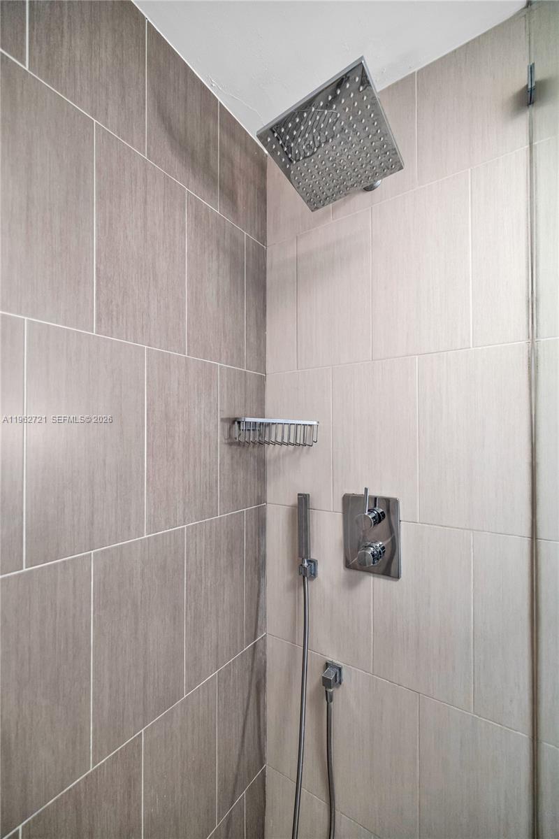 680 Northeast 64th Street, Unit APH3 Miami, FL 33138 - Photo 34 of 77 a bathroom with a shower