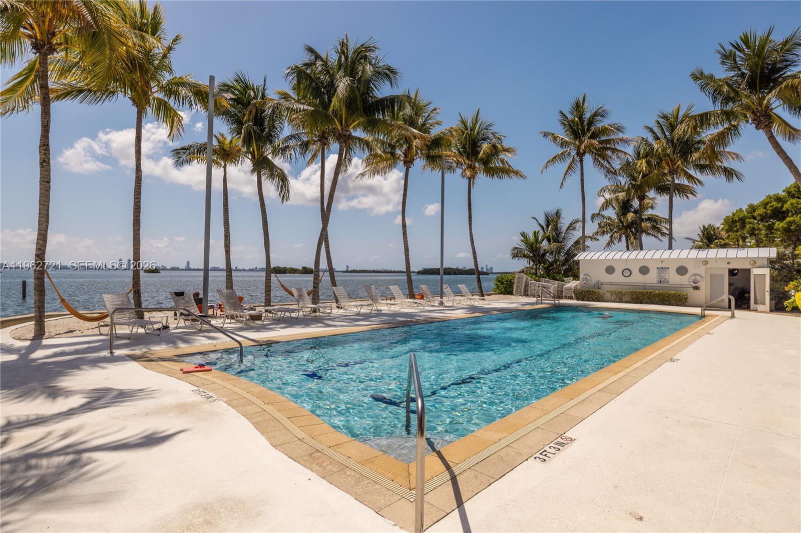 680 Northeast 64th Street, Unit APH3 Miami, FL 33138 - Photo 49 of 77 a view of a backyard with palm trees