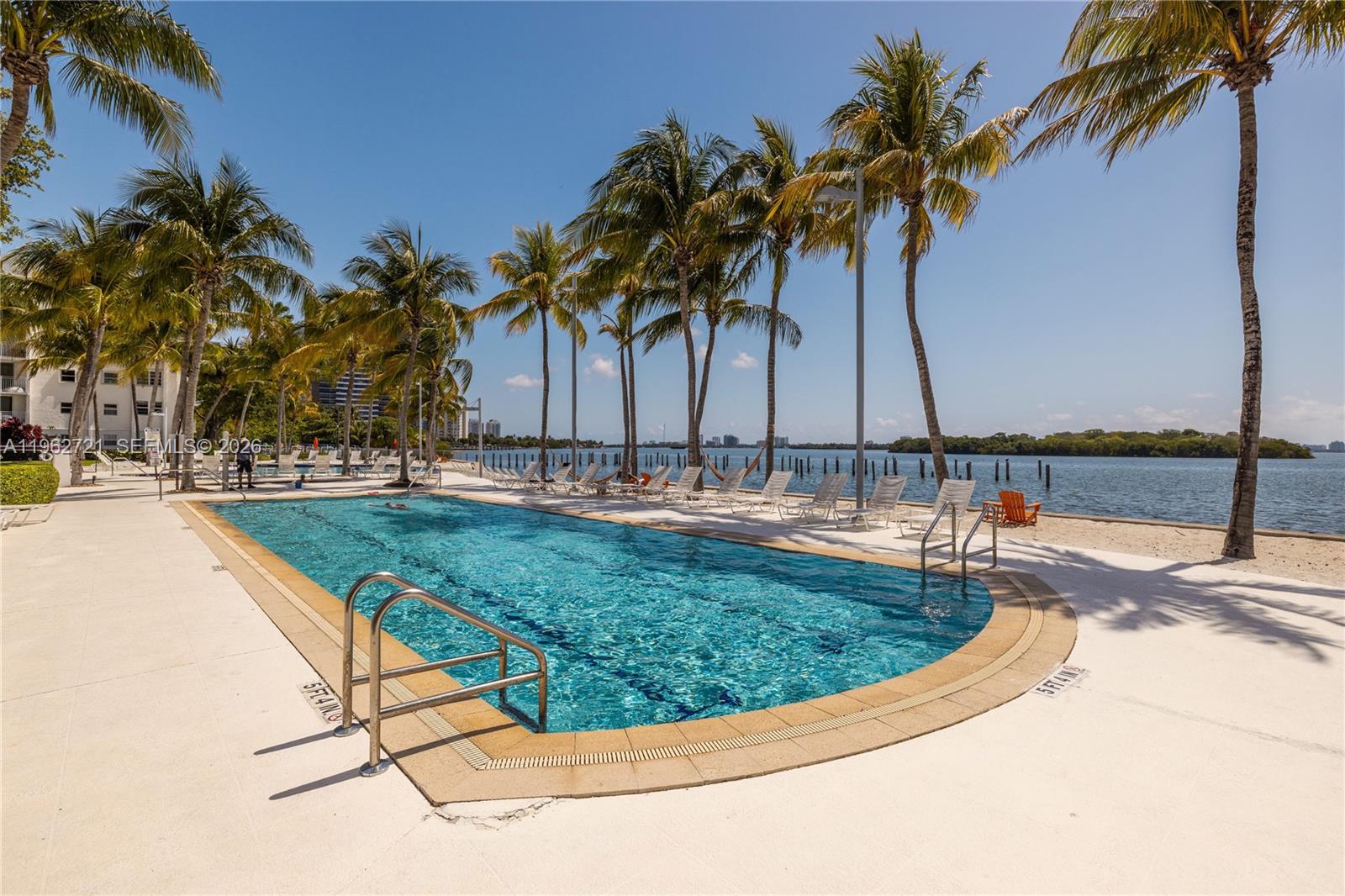 680 Northeast 64th Street, Unit APH3 Miami, FL 33138 - Photo 52 of 77 a view of a swimming pool with a patio