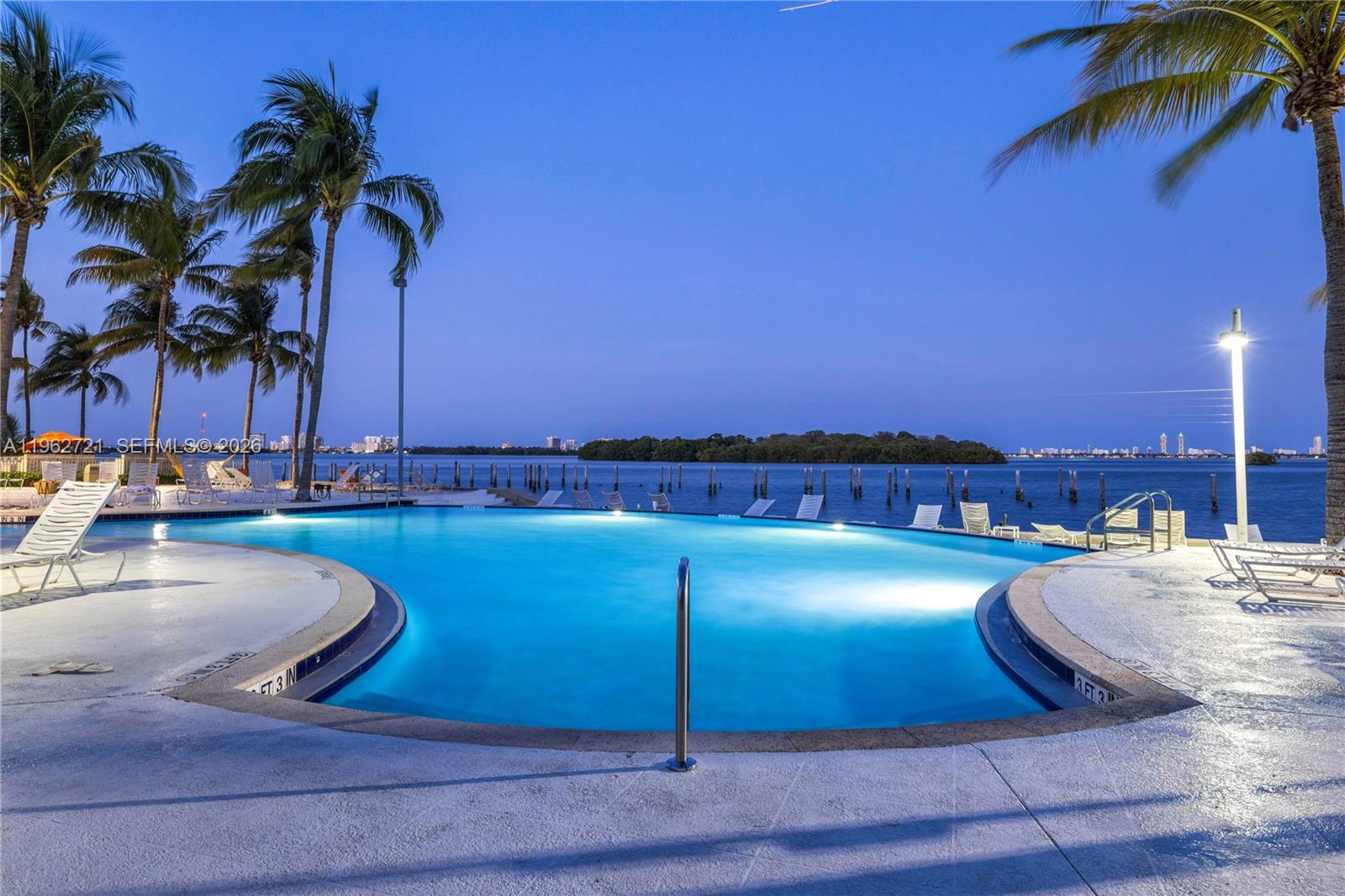 680 Northeast 64th Street, Unit APH3 Miami, FL 33138 - Photo 67 of 77 a view of a swimming pool and lake view