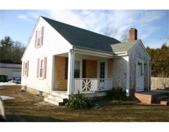 137 Forge Road Westport, MA 02790 - Photo 1 of 20 a front view of a house with garden