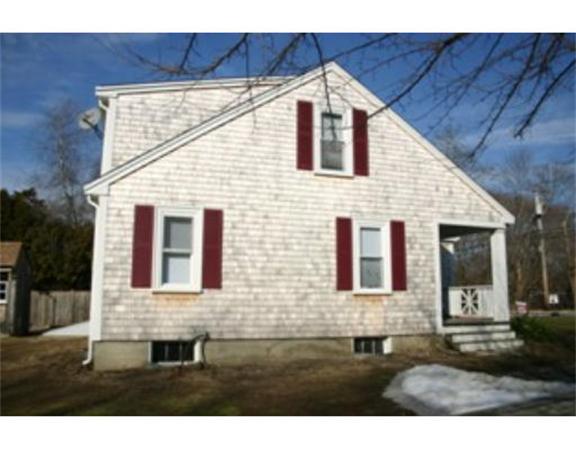137 Forge Road Westport, MA 02790 - Photo 2 of 20 a front view of a house with a yard