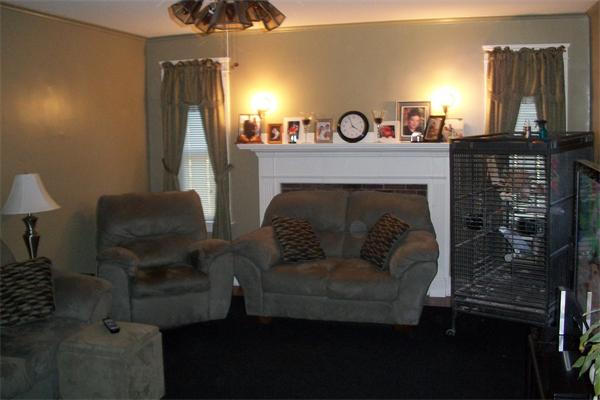 137 Forge Road Westport, MA 02790 - Photo 4 of 20 a living room with furniture and a fireplace