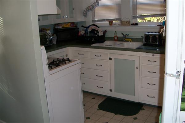 137 Forge Road Westport, MA 02790 - Photo 6 of 20 a kitchen with white cabinets and appliances