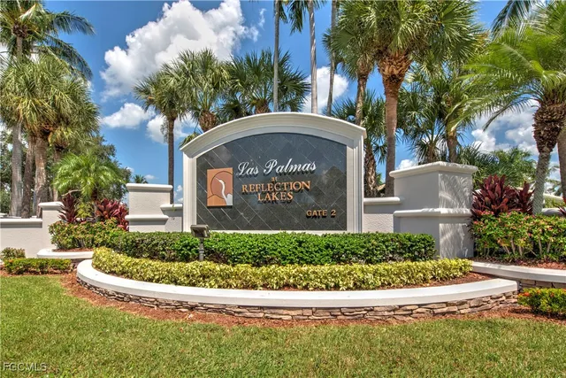 a view of fountain and small yard