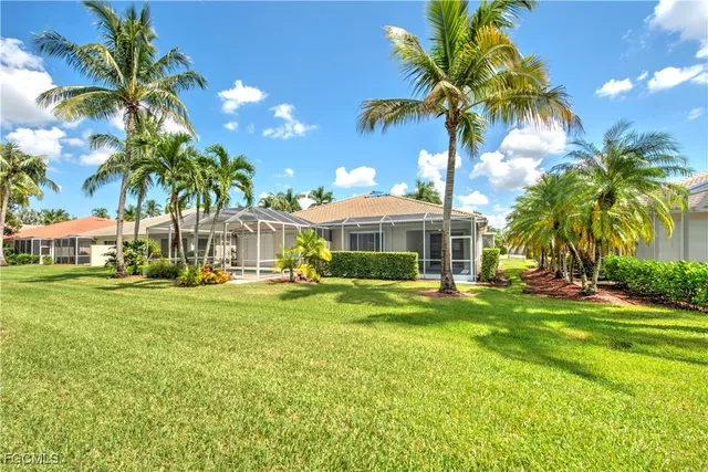 a front view of a house with swimming pool having outdoor seating
