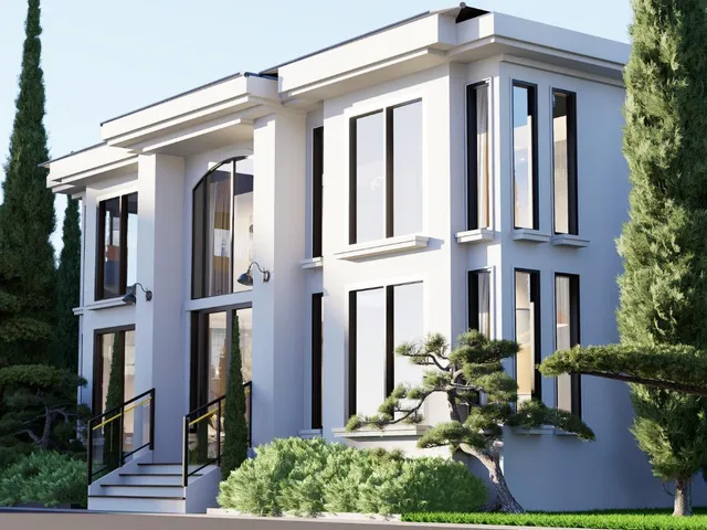 a front view of a house with plants and outdoor seating