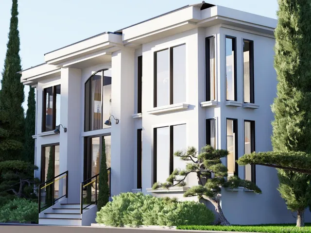 a front view of a house with plants and outdoor seating