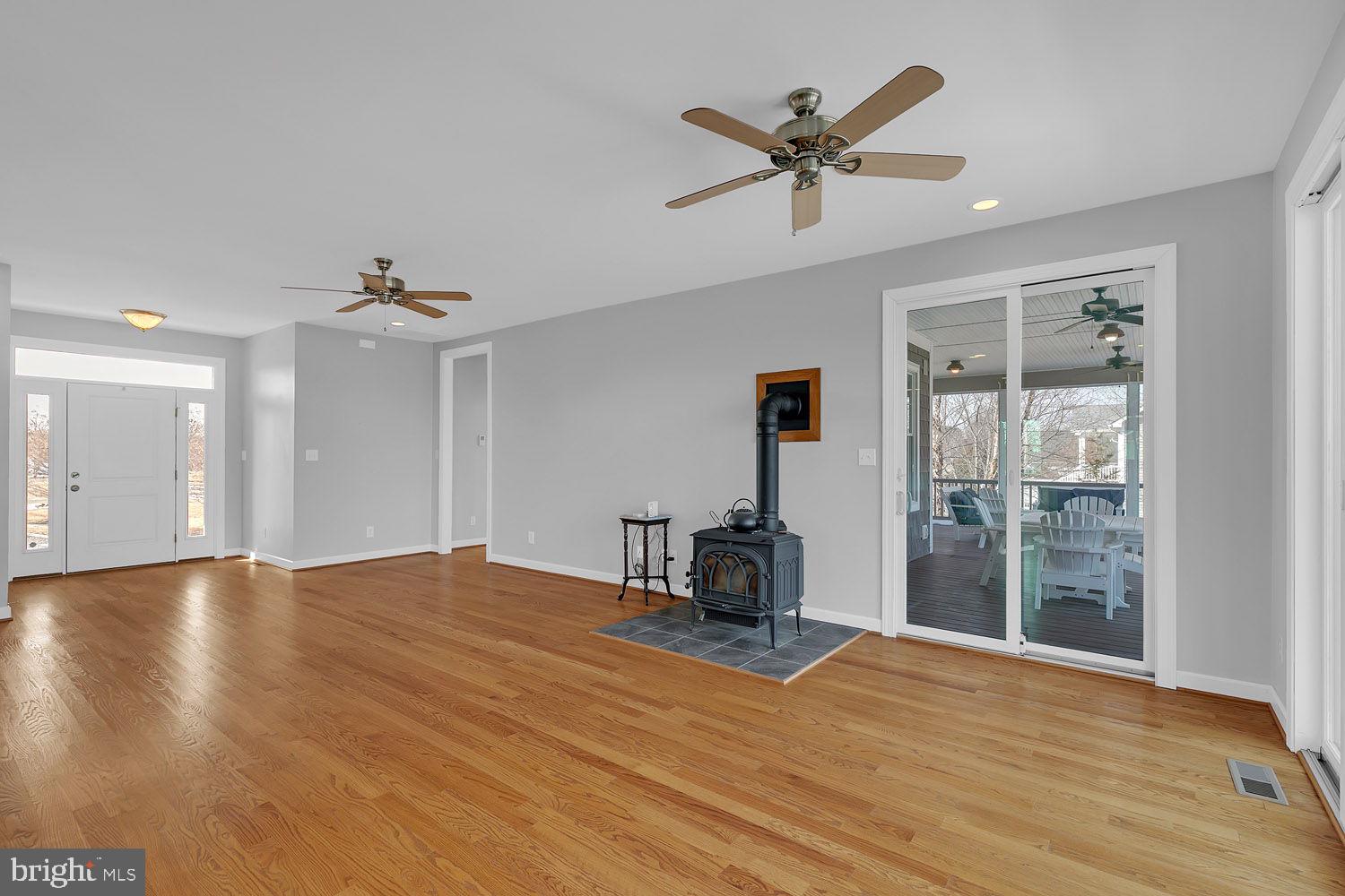 1469 Cowart Road Lottsburg, VA 22511 - Photo 15 of 54 a view of empty room with wooden floor and fan