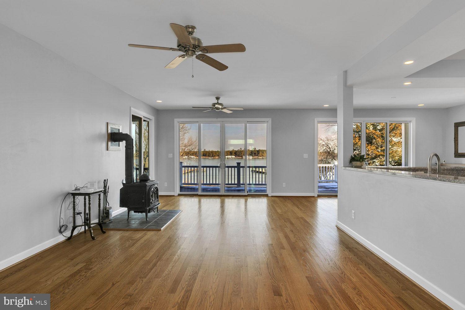 1469 Cowart Road Lottsburg, VA 22511 - Photo 16 of 54 a view of a living room a window and wooden floor