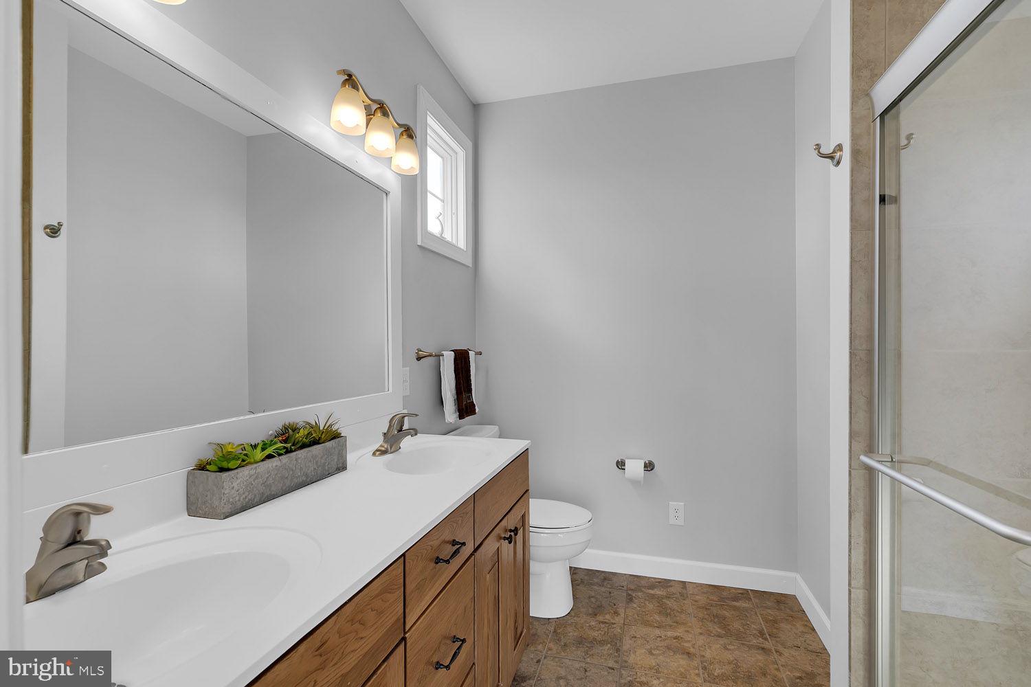 1469 Cowart Road Lottsburg, VA 22511 - Photo 29 of 54 a bathroom with a sink and a mirror