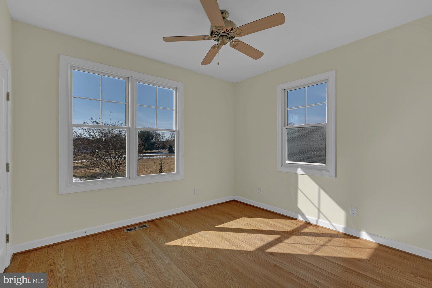 1469 Cowart Road Lottsburg, VA 22511 - Photo 31 of 54 a view of empty room with wooden floor and fan