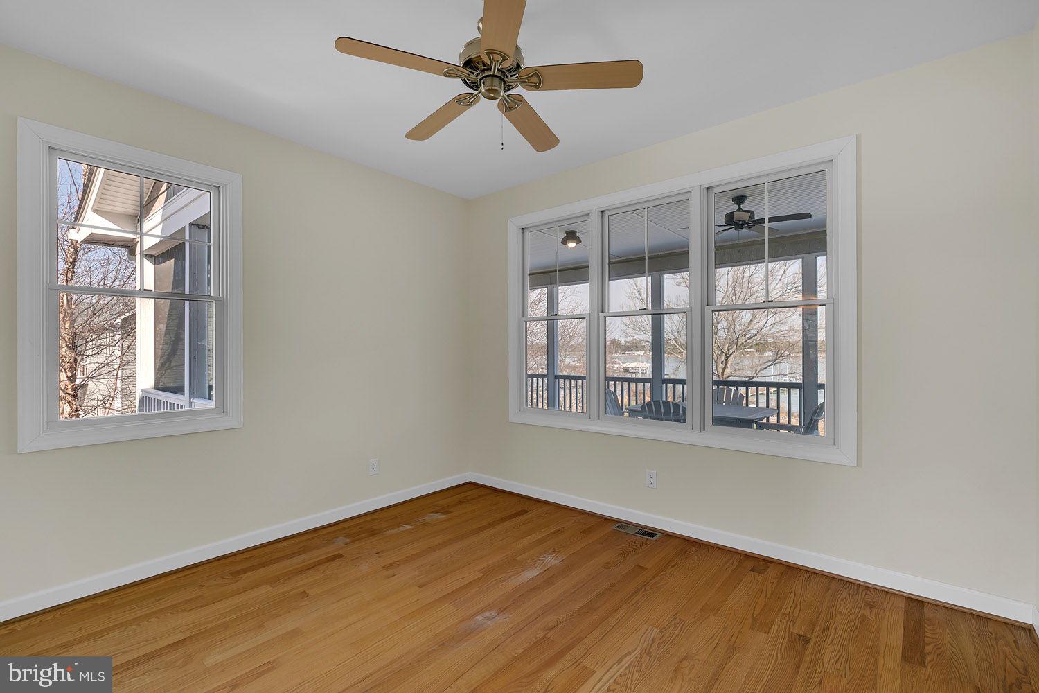1469 Cowart Road Lottsburg, VA 22511 - Photo 33 of 54 a view of an empty room with wooden floor and a window