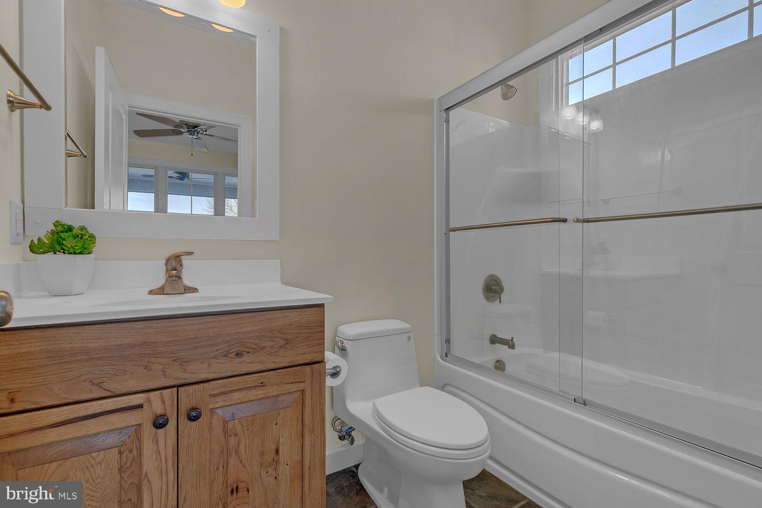 1469 Cowart Road Lottsburg, VA 22511 - Photo 34 of 54 a bathroom with a sink toilet and shower