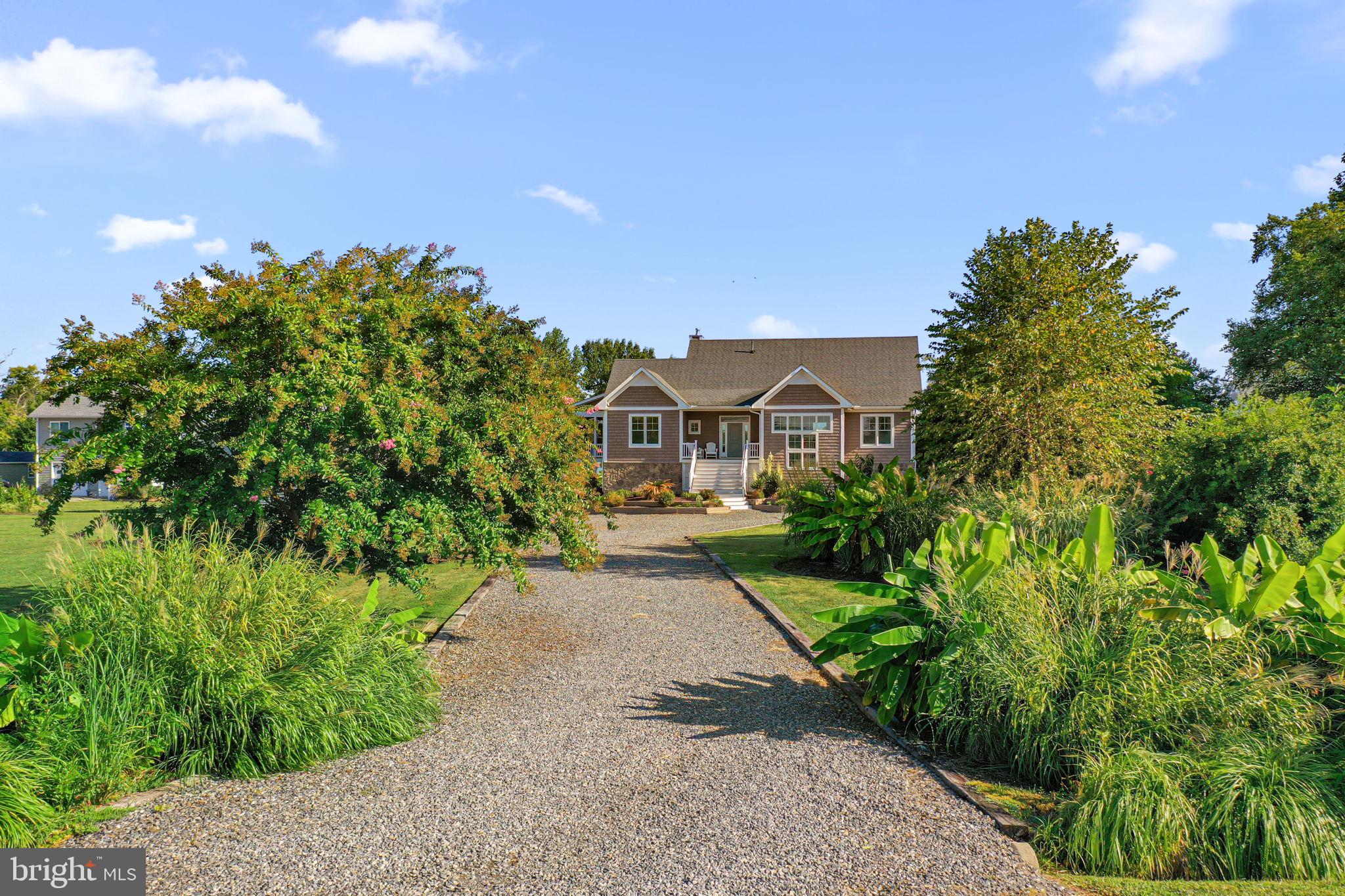 1469 Cowart Road Lottsburg, VA 22511 - Photo 49 of 54 a house with green field