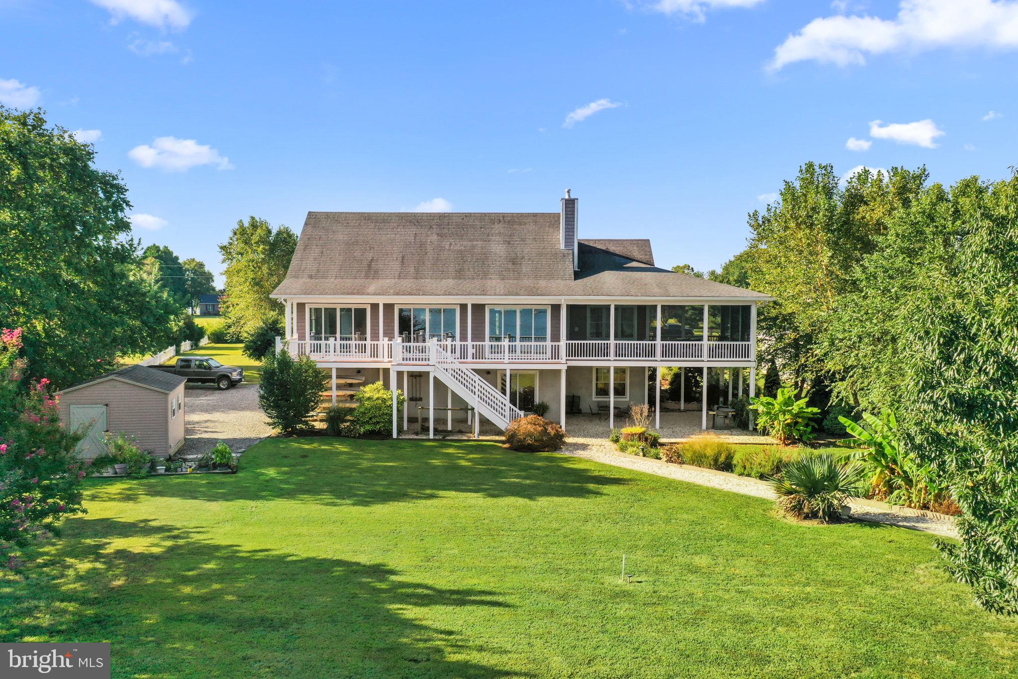 1469 Cowart Road Lottsburg, VA 22511 - Photo 7 of 54 a view of a house with swimming pool and garden