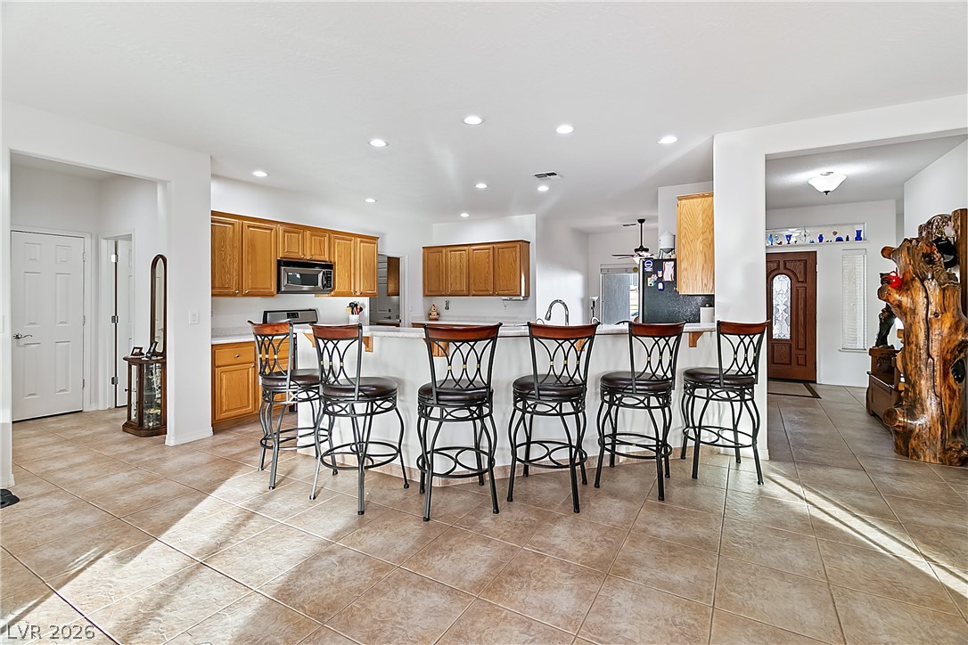 3505 Cottage Meadow Way Laughlin, NV 89029 - Photo 11 of 98 The Kitchen has a breakfast bar, perfect for stool seating.