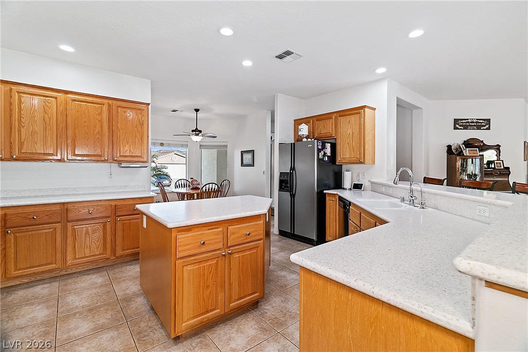 3505 Cottage Meadow Way Laughlin, NV 89029 - Photo 13 of 98 Kitchen has tons of counter space, a large kitchen island, and stainless steel appliances.