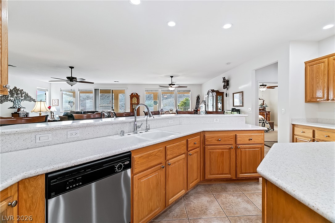3505 Cottage Meadow Way Laughlin, NV 89029 - Photo 15 of 98 The Kitchen has a dual basin sink and outlets built into the two tier countertop, perfect for external appliances.