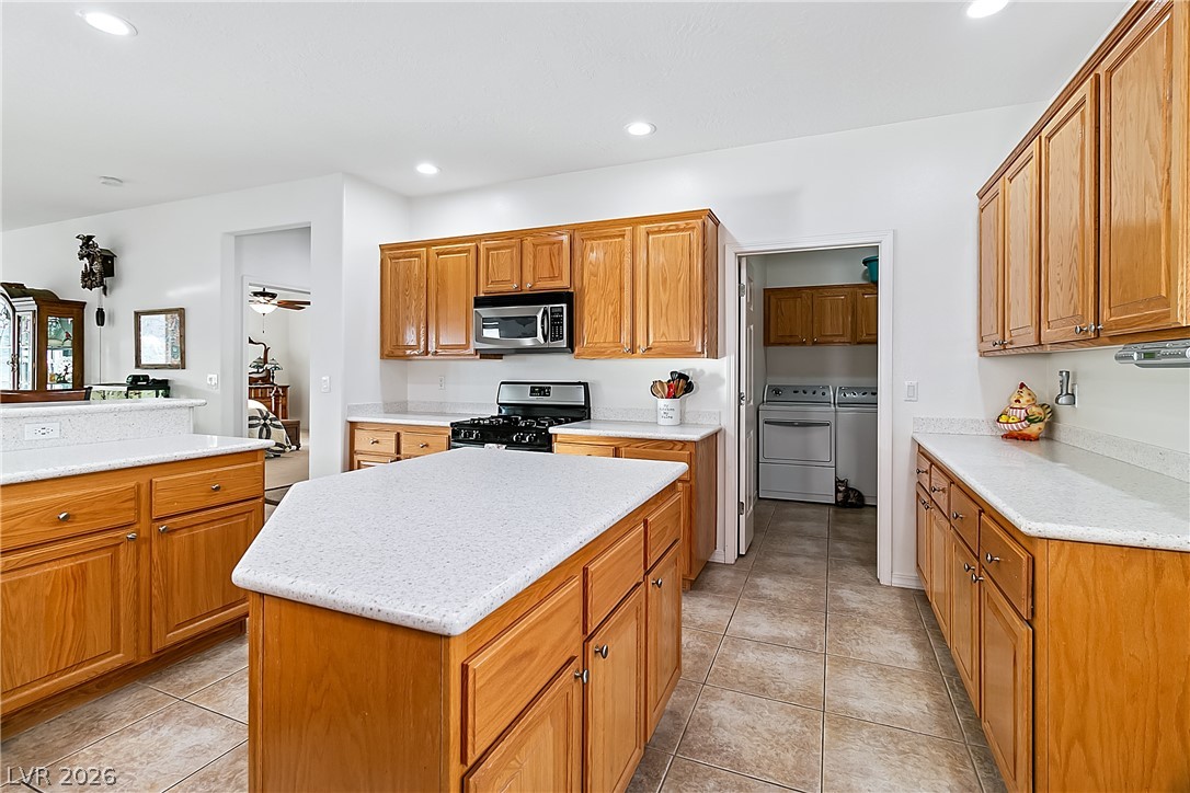 3505 Cottage Meadow Way Laughlin, NV 89029 - Photo 16 of 98 Alternate angle of the Kitchen and the plentiful wood cabinets.