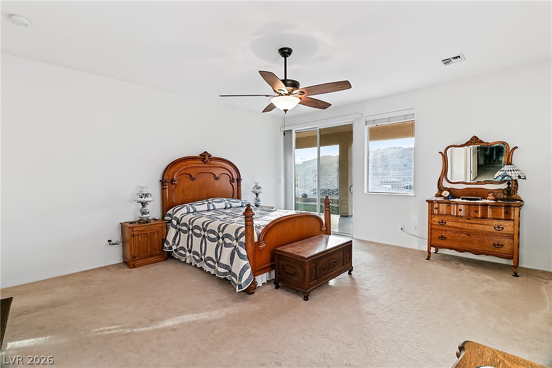 3505 Cottage Meadow Way Laughlin, NV 89029 - Photo 24 of 98 Alternate angle of the Primary bedroom with carpet flooring.