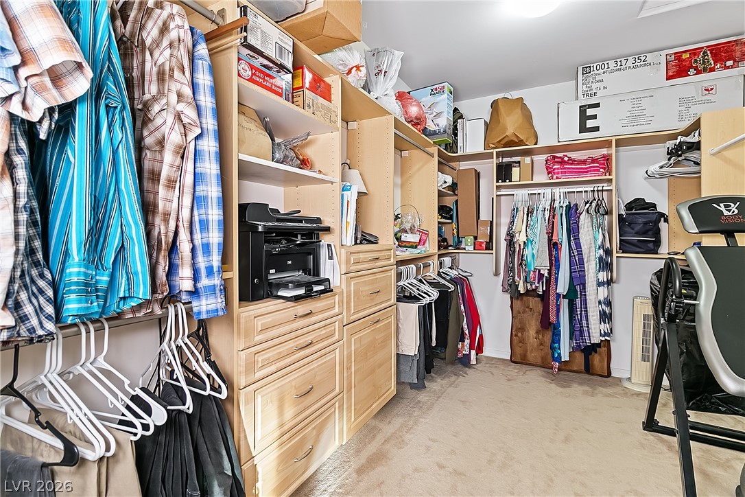3505 Cottage Meadow Way Laughlin, NV 89029 - Photo 26 of 98 Primary bedroom's walk-in closet with storage shelving.