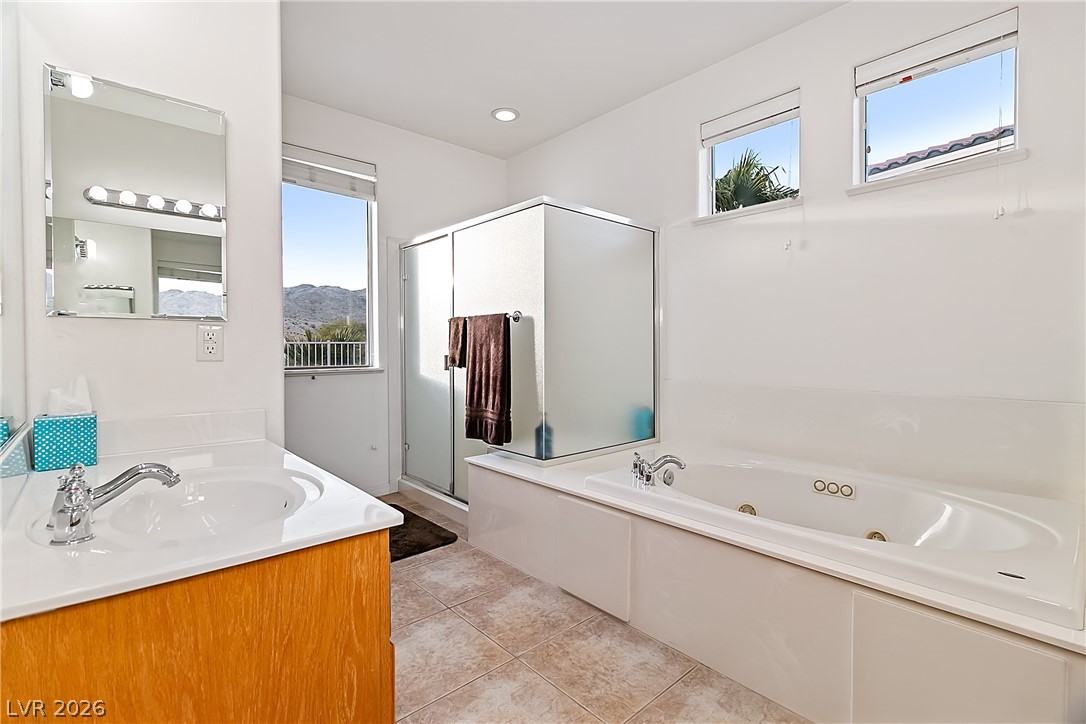 3505 Cottage Meadow Way Laughlin, NV 89029 - Photo 29 of 98 Primary bathroom also has a standalone tub, walk-in shower, and toilet room.