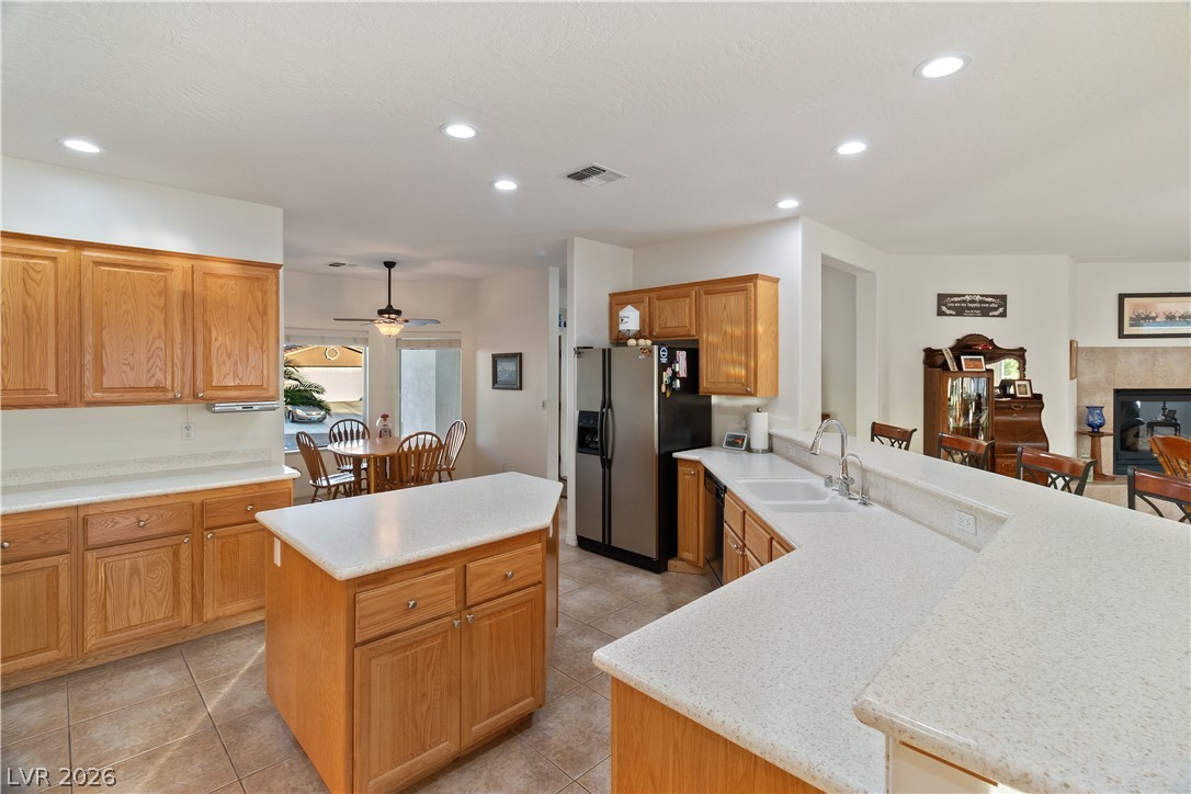 3505 Cottage Meadow Way Laughlin, NV 89029 - Photo 4 of 98 Alternate angle of the Kitchen, showcasing the two-tier countertop that serves as a breakfast bar, perfect for stool seating and/or casual dining.