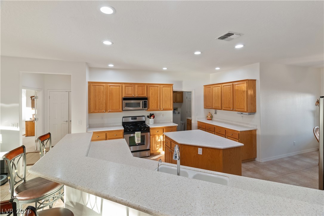 3505 Cottage Meadow Way Laughlin, NV 89029 - Photo 5 of 98 Here we can see the Kitchen's breakfast bar, perfect for stool seating and casual dining.