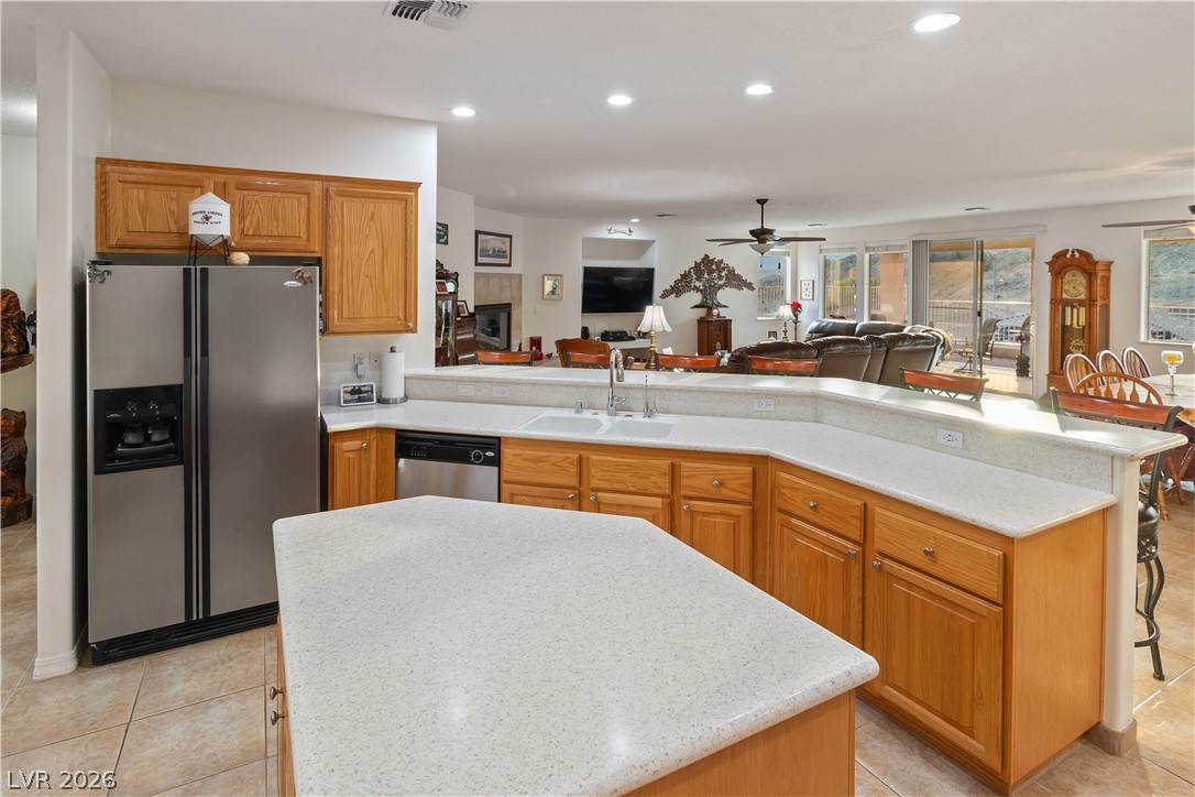 3505 Cottage Meadow Way Laughlin, NV 89029 - Photo 7 of 98 Alternate angle of the Kitchen showcasing the Kitchen island, which is also fitted with wood cabinetry for all your culinary storage needs.