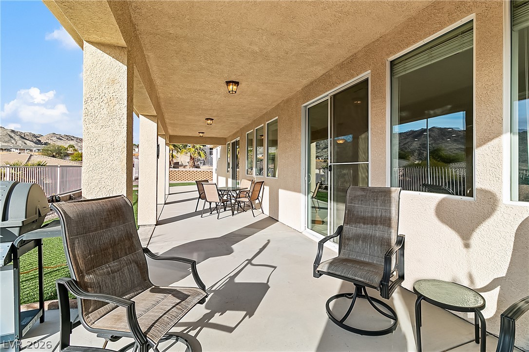 3505 Cottage Meadow Way Laughlin, NV 89029 - Photo 79 of 98 The back covered patio with sliding glass door to the Great room.