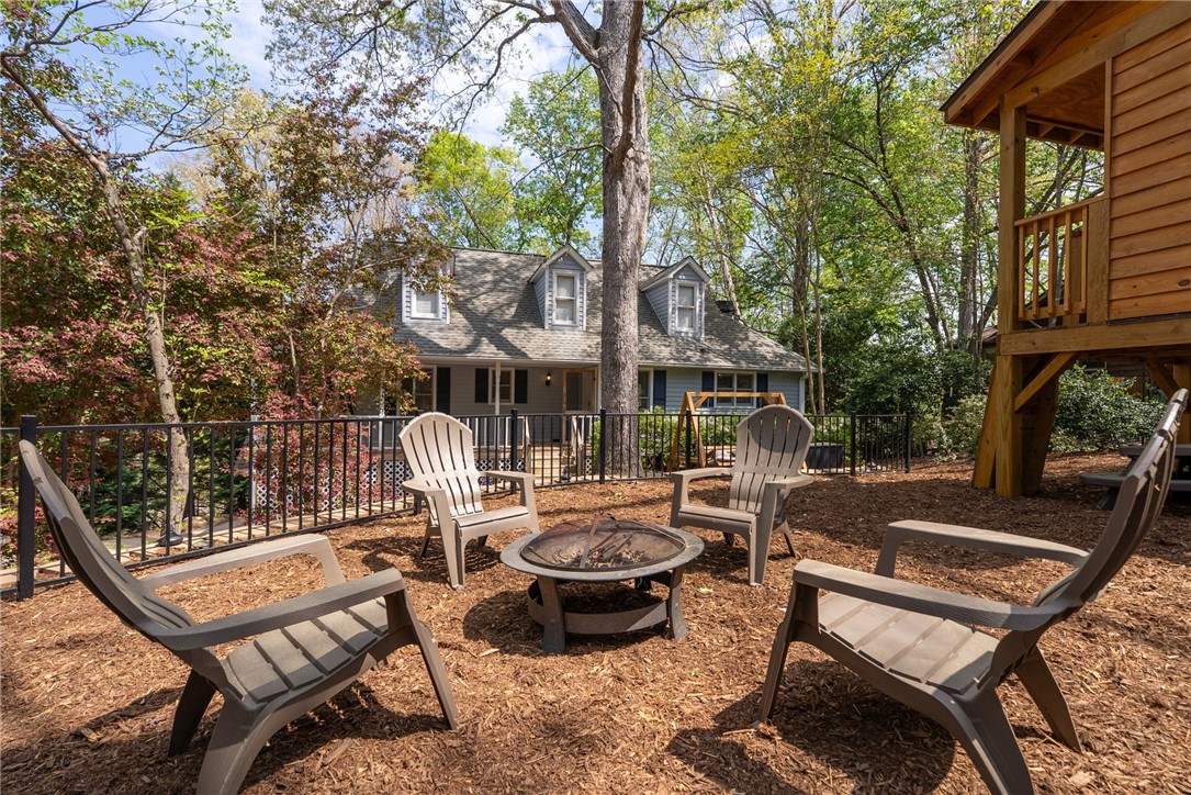 1002 Whitfield Point Road Anderson, SC 29626 - Photo 16 of 49 This charming home offers a serene outdoor space, perfect for relaxation and gatherings.