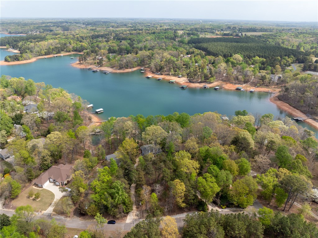 1002 Whitfield Point Road Anderson, SC 29626 - Photo 2 of 49 This tranquil lakeside property offers a picturesque setting with verdant trees and serene waters.
