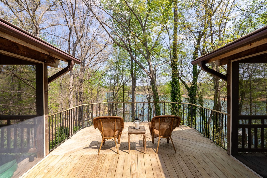 1002 Whitfield Point Road Anderson, SC 29626 - Photo 21 of 49 This serene deck provides tranquil water views amidst lush, verdant surroundings.