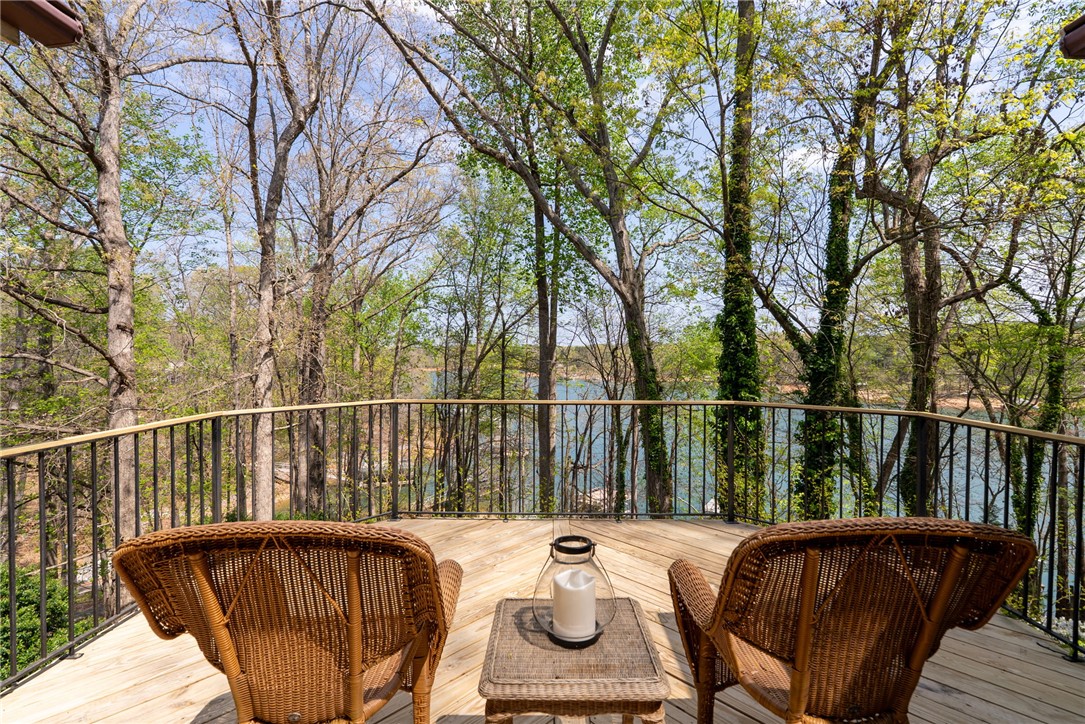 1002 Whitfield Point Road Anderson, SC 29626 - Photo 22 of 49 Relax on the expansive deck, enjoying tranquil water views through lush trees.