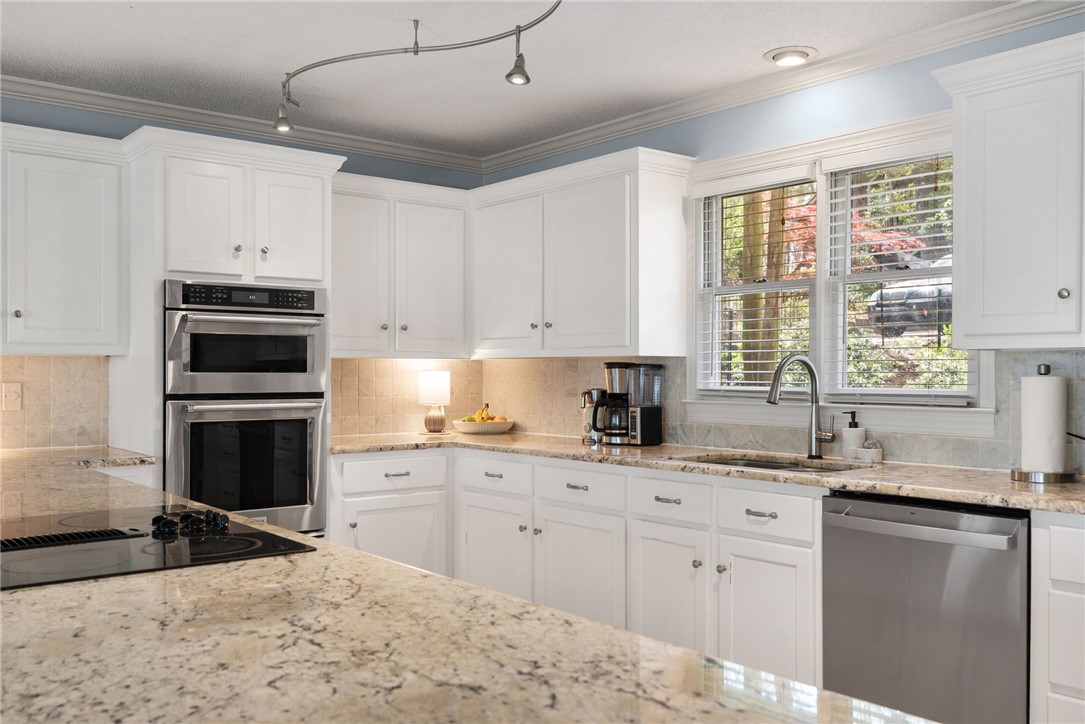 1002 Whitfield Point Road Anderson, SC 29626 - Photo 24 of 49 Bright and airy, this kitchen features modern appliances and a spacious countertop perfect for culinary creations.