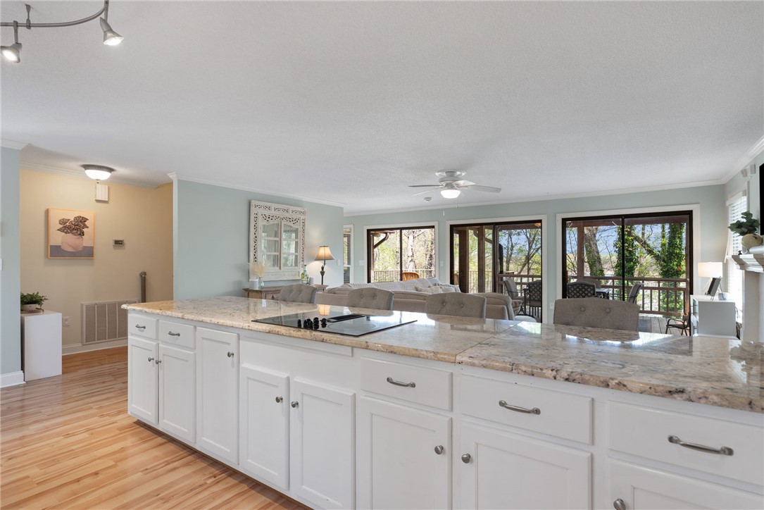 1002 Whitfield Point Road Anderson, SC 29626 - Photo 26 of 49 This bright kitchen with a spacious island connects seamlessly to the inviting living area.
