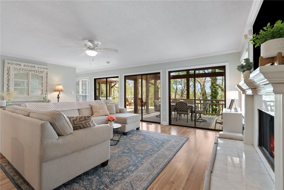 1002 Whitfield Point Road Anderson, SC 29626 - Photo 32 of 49 This airy living space features a warm fireplace and seamless outdoor access.