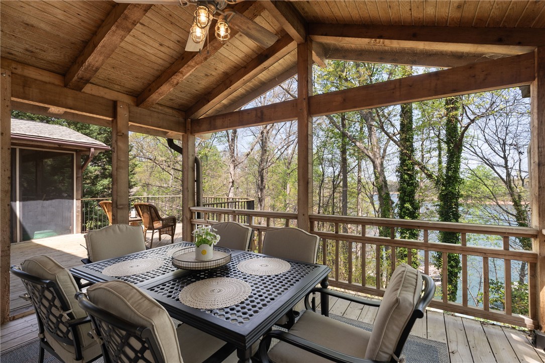 1002 Whitfield Point Road Anderson, SC 29626 - Photo 34 of 49 Enjoy tranquil water views from this expansive, wood-beamed outdoor living area.