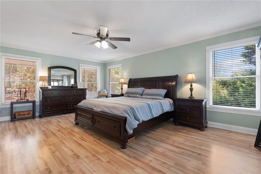 1002 Whitfield Point Road Anderson, SC 29626 - Photo 35 of 49 This spacious bedroom offers ample light and comfortable hardwood floors.