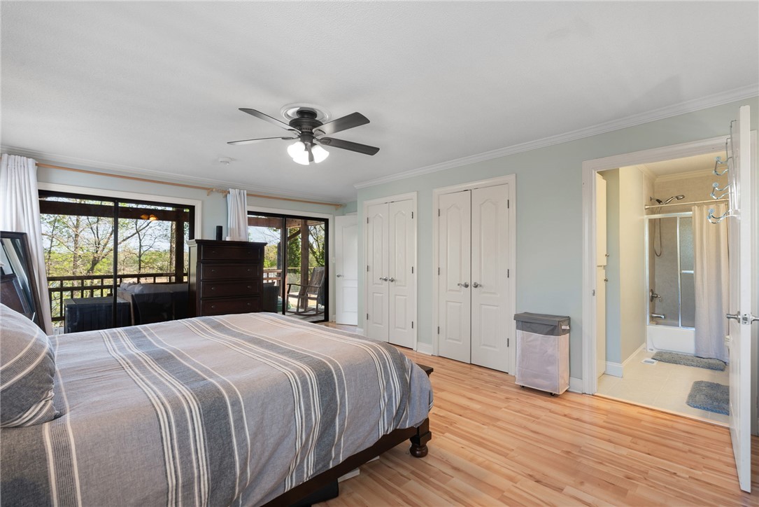 1002 Whitfield Point Road Anderson, SC 29626 - Photo 36 of 49 This tranquil bedroom features outdoor access, creating a seamless indoor-outdoor living experience.