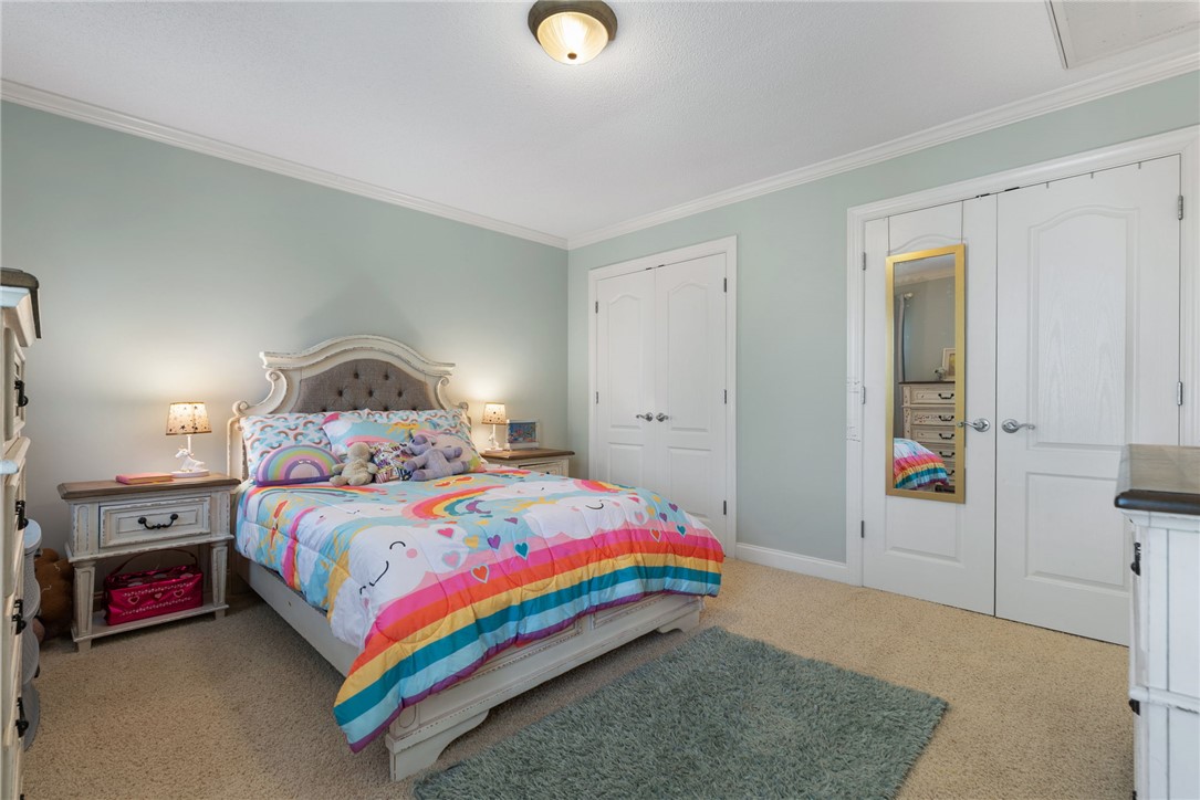 1002 Whitfield Point Road Anderson, SC 29626 - Photo 39 of 49 This spacious bedroom offers ample room for comfort and relaxation, with elegant crown molding and plush carpeting.