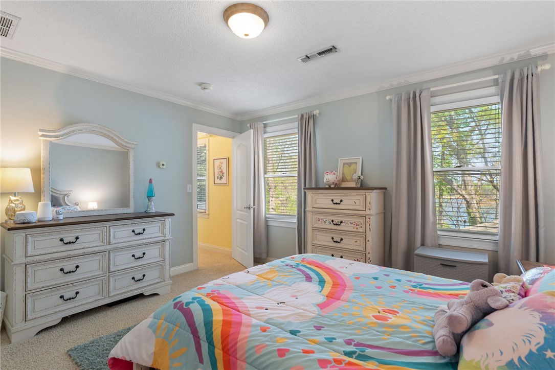1002 Whitfield Point Road Anderson, SC 29626 - Photo 40 of 49 This cozy bedroom features comfortable carpet flooring and crown molding, perfect for relaxing after a long day.