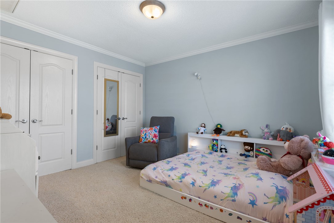1002 Whitfield Point Road Anderson, SC 29626 - Photo 41 of 49 This cozy bedroom features plush carpeting and elegant crown molding, creating a comfortable and inviting atmosphere.
