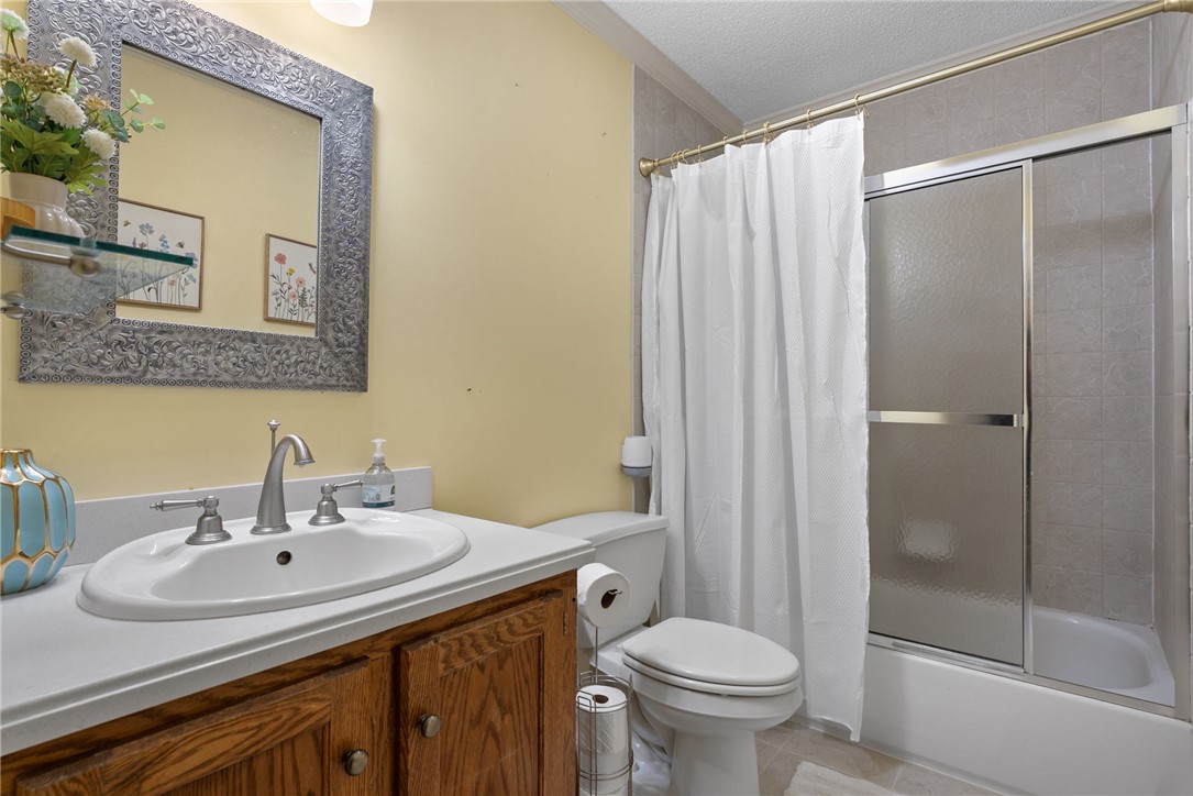 1002 Whitfield Point Road Anderson, SC 29626 - Photo 43 of 49 This functional bathroom features a shower-tub combo, providing practical amenities for daily routines.