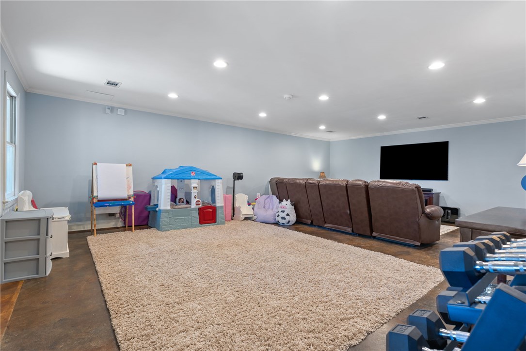 1002 Whitfield Point Road Anderson, SC 29626 - Photo 44 of 49 This versatile room offers ample space for various activities, featuring recessed lighting and crown molding.